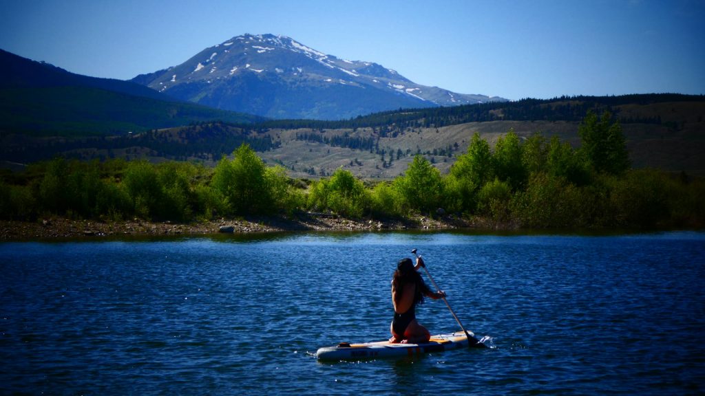 Paddleboarder on lake with Mt Elbert in the background